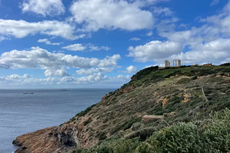The Cape Sounion headland seen from the coast road, with the temple on the ridge above the Aegean